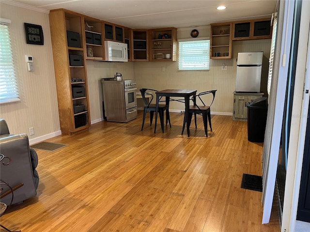 dining room with light hardwood / wood-style flooring