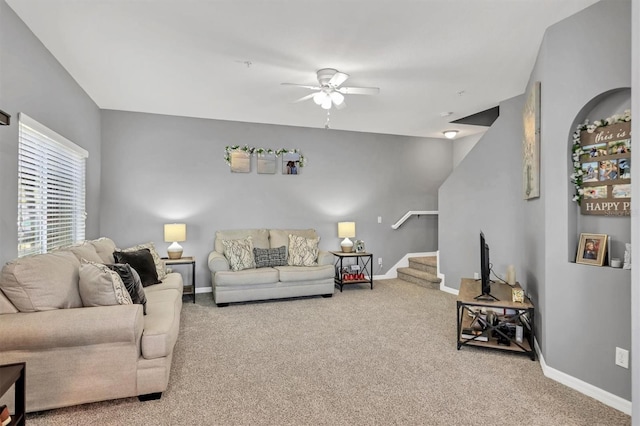 living room with carpet flooring and ceiling fan