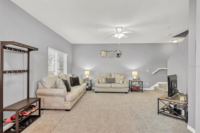 carpeted living room featuring ceiling fan