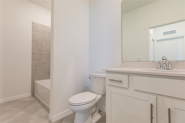 full bathroom featuring tile patterned flooring, bathtub / shower combination, vanity, and toilet