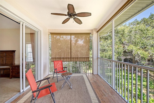 sunroom featuring ceiling fan