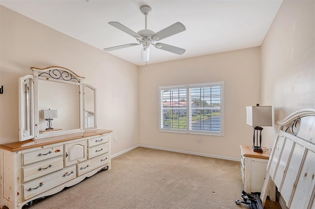 bedroom with light carpet and ceiling fan