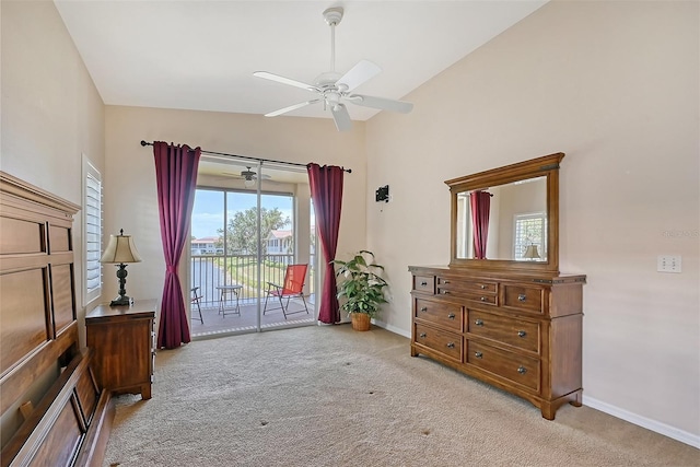 bedroom with access to exterior, light carpet, ceiling fan, and lofted ceiling