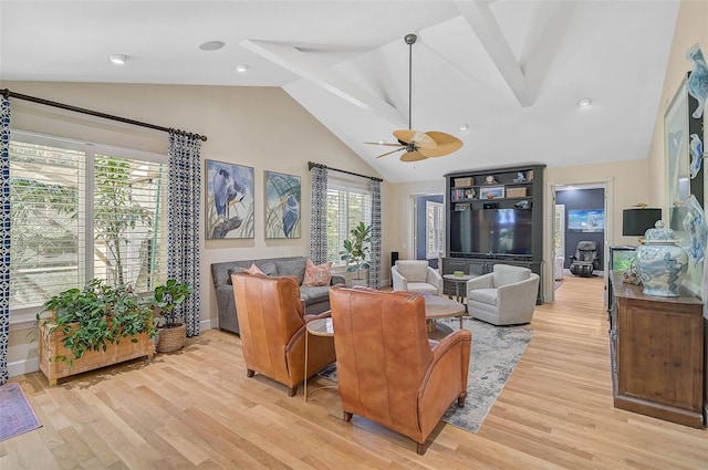 living room featuring high vaulted ceiling, ceiling fan, and light hardwood / wood-style flooring