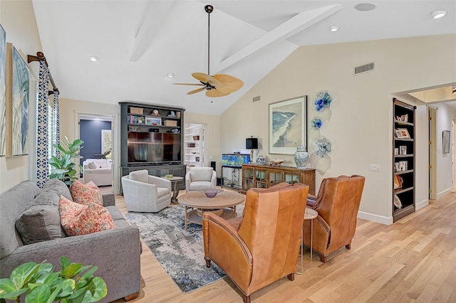 living room with high vaulted ceiling, ceiling fan, and light wood-type flooring