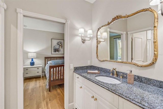 bathroom featuring vanity and hardwood / wood-style floors