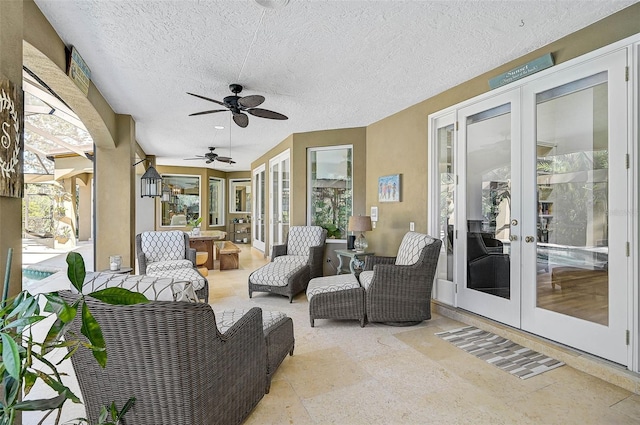 view of patio / terrace featuring an outdoor hangout area, french doors, and ceiling fan