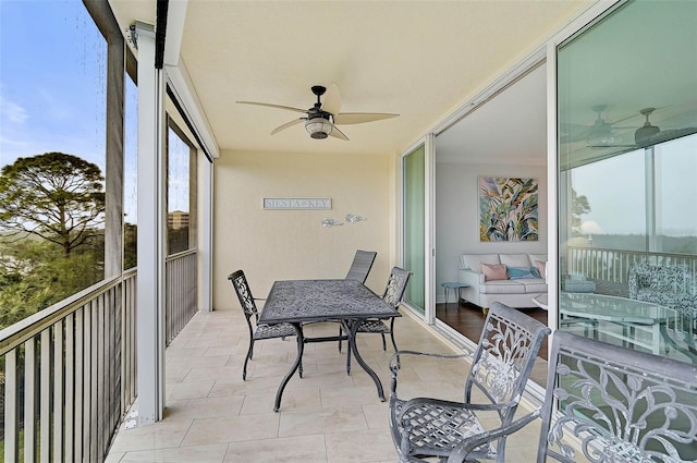 sunroom / solarium with ceiling fan