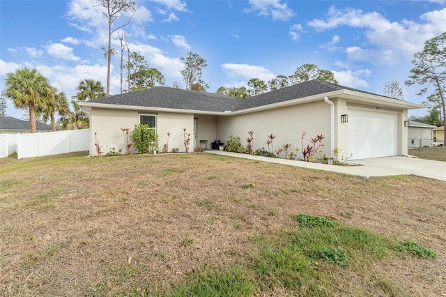 ranch-style home featuring a garage and a front yard