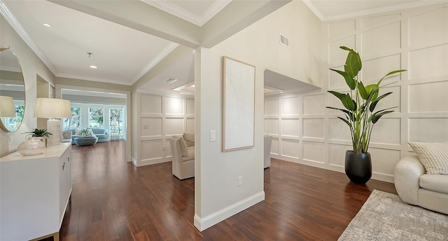 interior space with dark hardwood / wood-style floors and ornamental molding