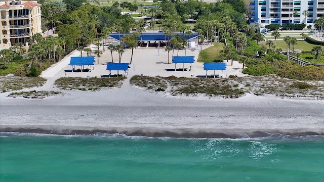 drone / aerial view with a beach view and a water view