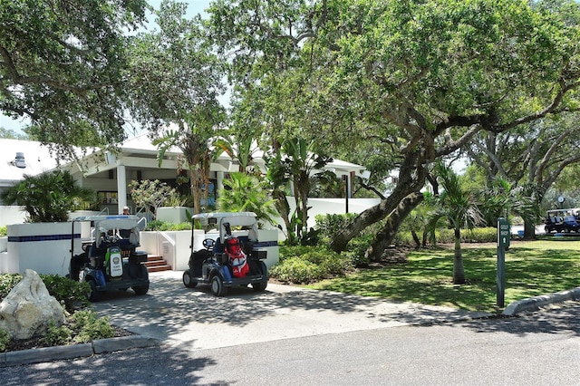 view of vehicle parking featuring a yard