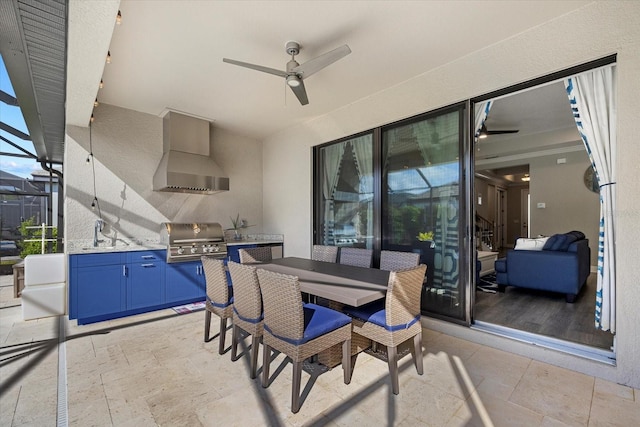 view of patio with grilling area, ceiling fan, a lanai, outdoor dining area, and an outdoor kitchen