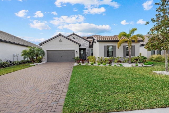 view of front of house featuring a front yard and a garage