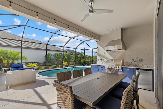 view of patio with area for grilling, a lanai, sink, and grilling area