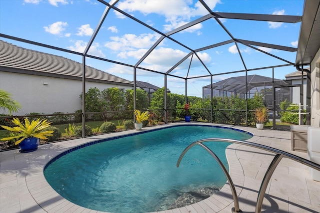 view of pool featuring a patio area and a lanai