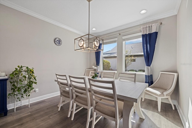 dining room with ornamental molding, an inviting chandelier, and dark wood-type flooring