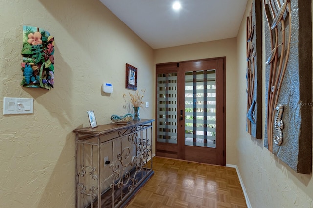 entryway with parquet floors