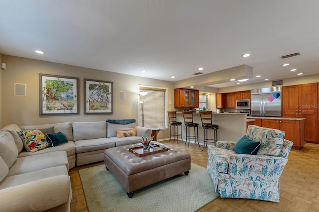 living room featuring light parquet flooring