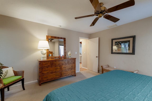 bedroom with ceiling fan and light colored carpet