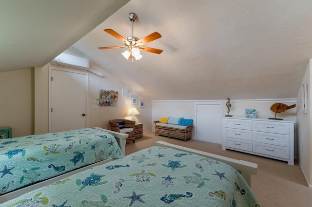 carpeted bedroom with a textured ceiling, ceiling fan, lofted ceiling, and a wall unit AC