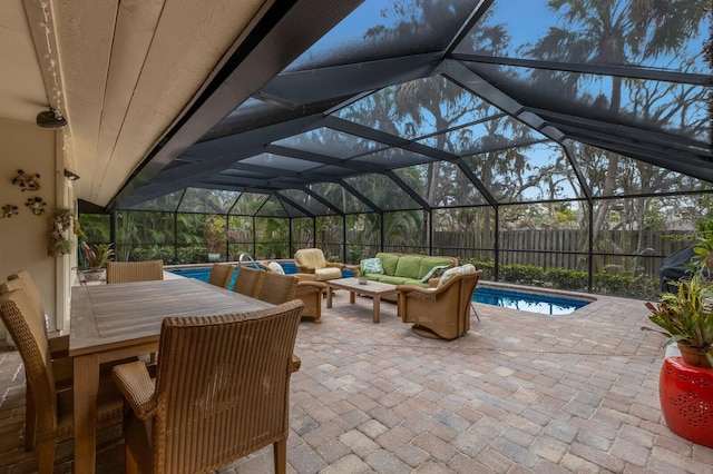 view of patio / terrace with outdoor lounge area, a fenced in pool, and a lanai