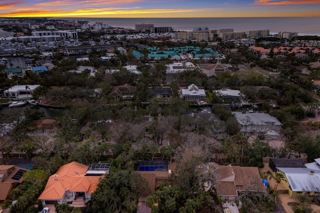 aerial view at dusk with a water view