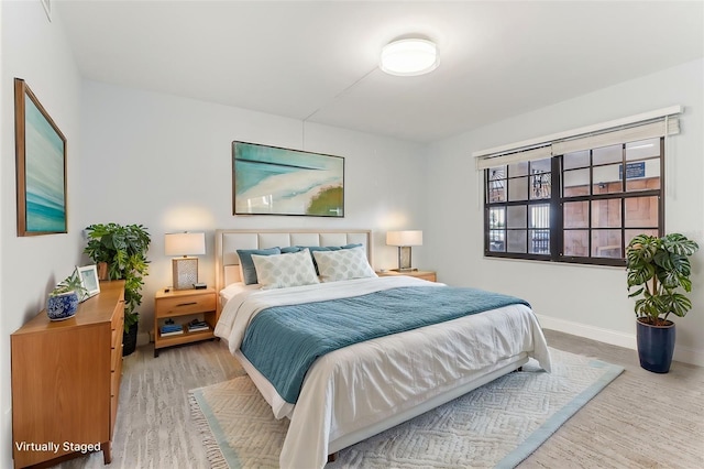 bedroom with light hardwood / wood-style flooring