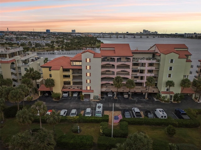 outdoor building at dusk featuring a water view