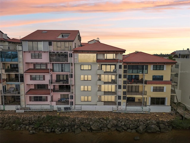 view of outdoor building at dusk