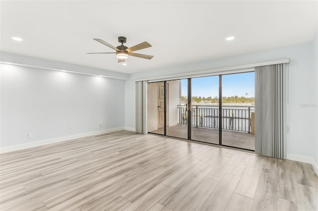 unfurnished room featuring ceiling fan and light hardwood / wood-style flooring