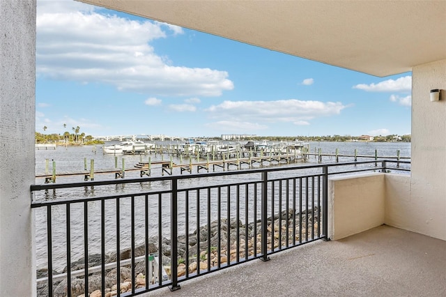 balcony featuring a water view