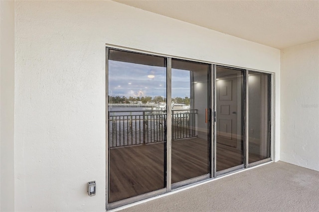 entrance to property featuring a balcony