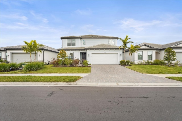 front of property featuring a garage and a front yard