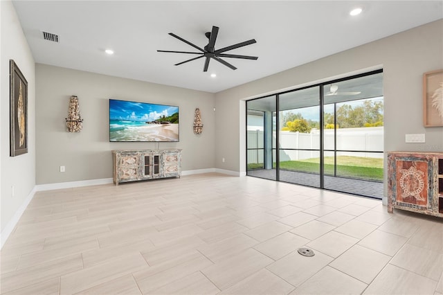 unfurnished living room featuring ceiling fan