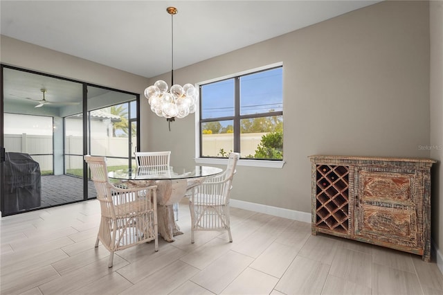 dining area featuring plenty of natural light and a chandelier