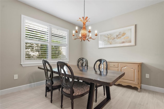 dining space with an inviting chandelier and light wood-type flooring