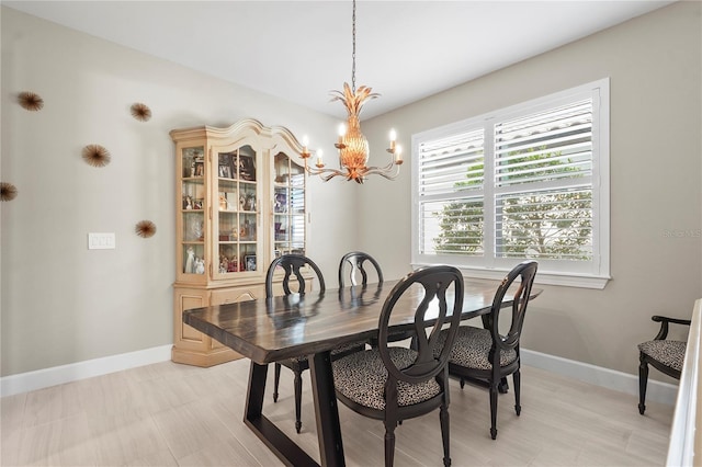 dining space featuring a notable chandelier