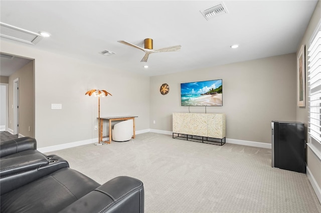 carpeted living room featuring ceiling fan