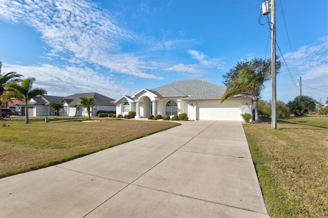 ranch-style home with a garage and a front yard