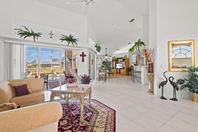 tiled living room featuring high vaulted ceiling and ceiling fan