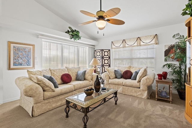 carpeted living room with lofted ceiling, ceiling fan, and a healthy amount of sunlight