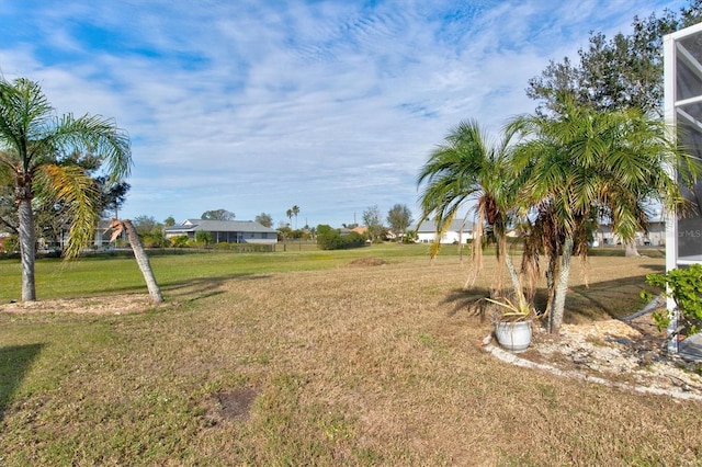 view of yard with a lanai