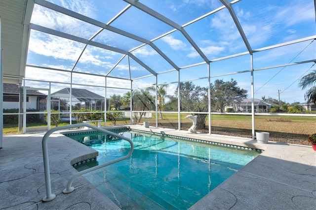 view of swimming pool with a lanai and a patio area