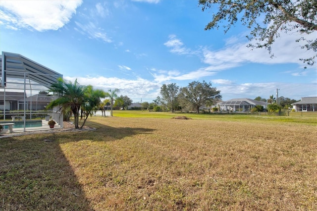 view of yard with a lanai