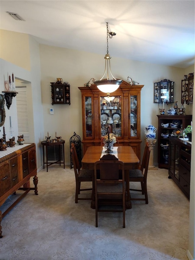 view of carpeted dining area