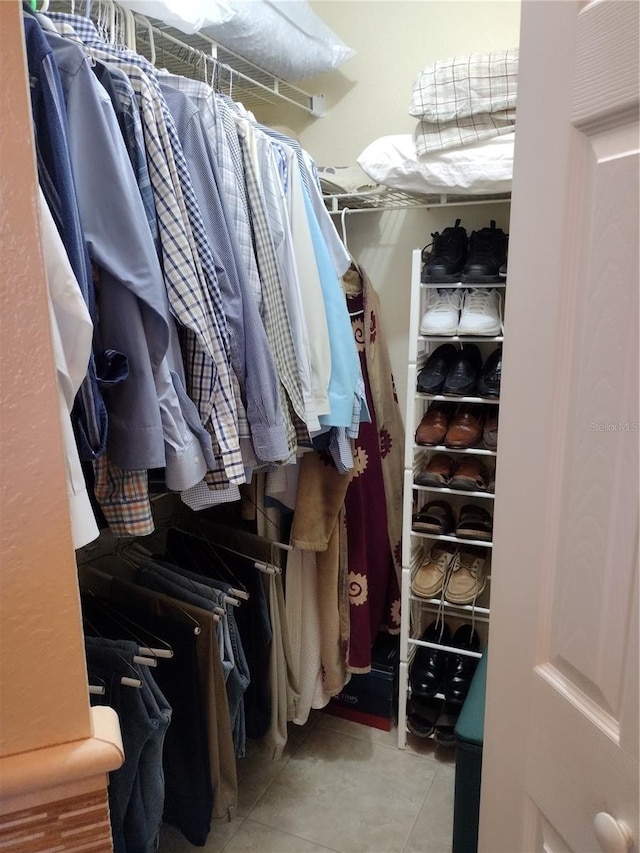 spacious closet with light tile patterned flooring