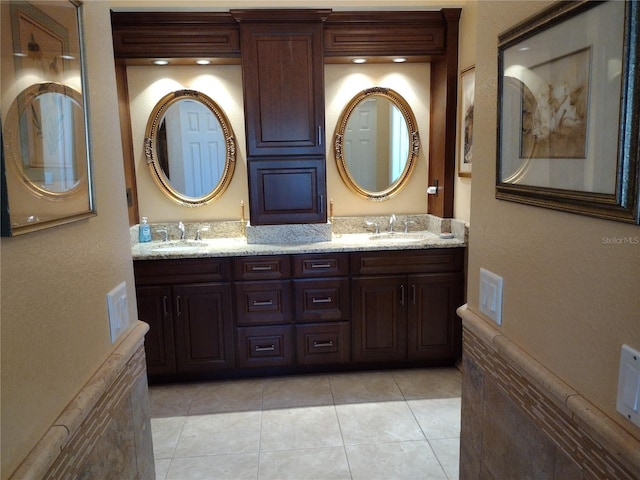 bathroom with tile patterned floors and vanity