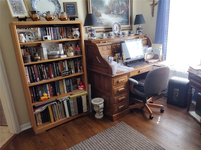 home office with hardwood / wood-style floors