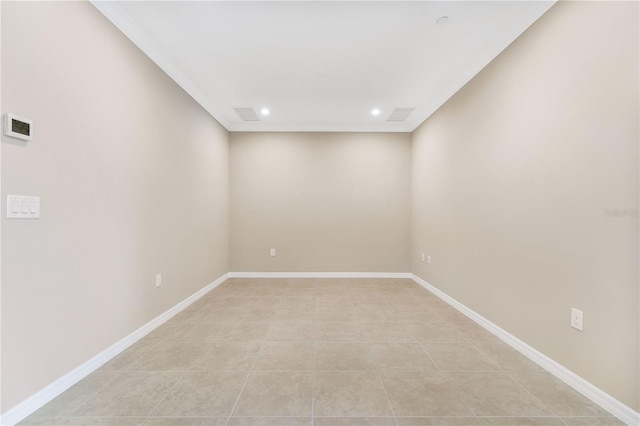 tiled empty room featuring ornamental molding